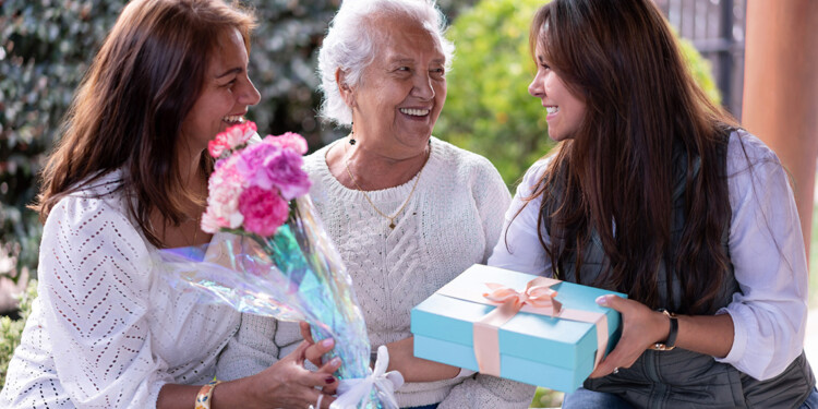 Three generations portrait celebrating motherâs day all smiling very happy - Celebration concepts